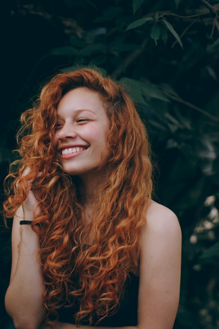 female patient smiling after getting tooth repair from the best dentist San Antonio